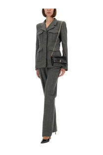 Black crocodile textured crossbody bag with gold chain strap featured with alexander mcqueen grey wool jacket