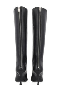 Back view of alexanderwang women’s heeled black leather knee-high boots with glossy finish and silver zippers