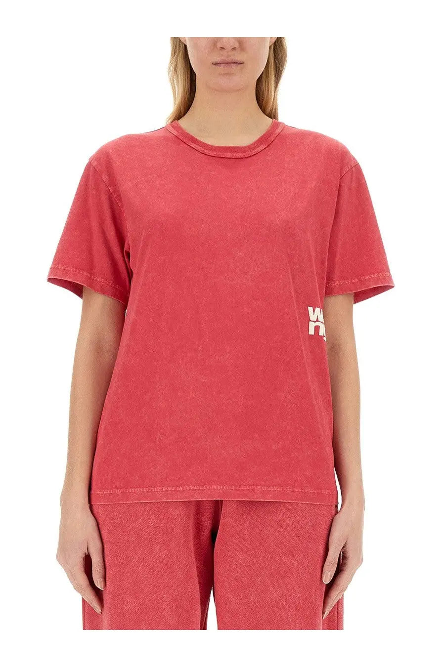 Alexanderwang women’s soft faded coral cotton t-shirt with subtle distressed texture and small white logo on chest