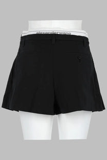 Alexanderwang women’s black pleated shorts with a white elastic waistband featuring the alexanderwang logo in black text