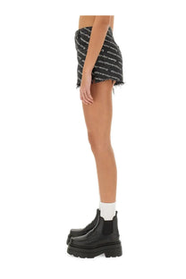 Alexanderwang women’s black denim mini skirt with white logo print and frayed hem, styled as shorts gray product
