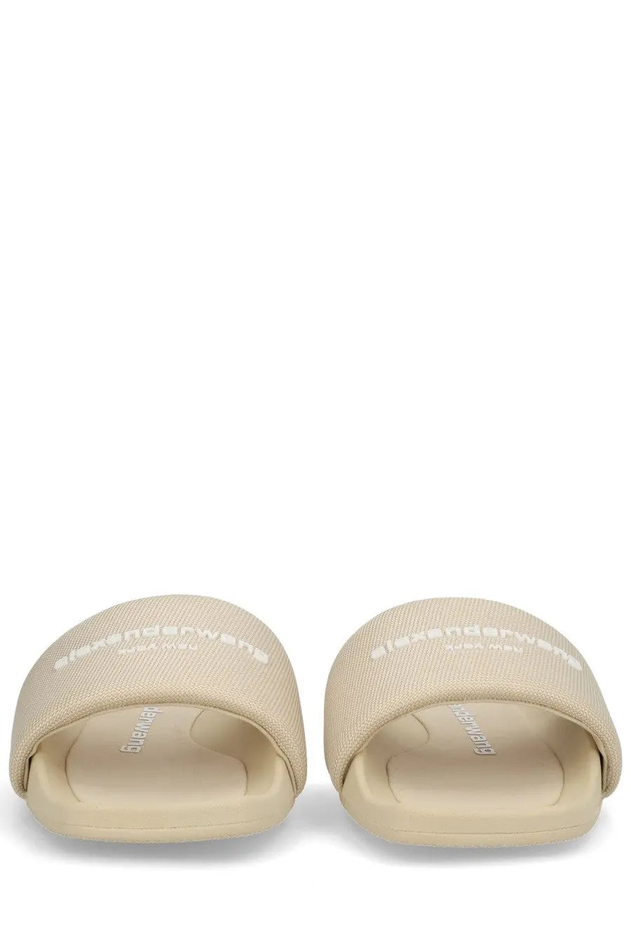 Beige alexander mcqueen slide sandals with textured fabric upper and embossed branding for stylish slip on wear