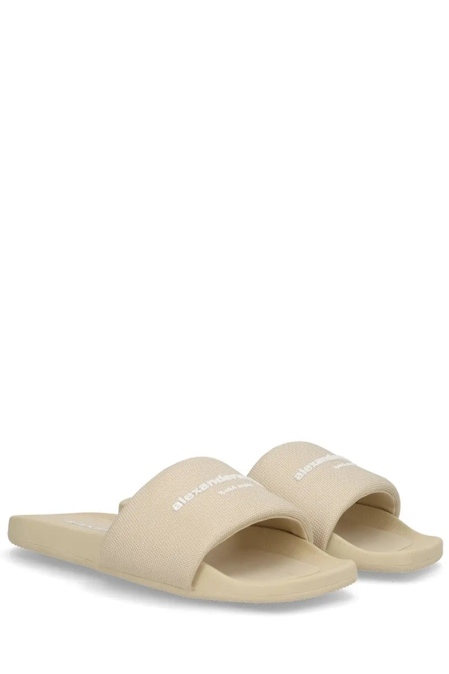 Beige alexanderwang women’s slip on slide sandals with textured fabric strap and white logo branding