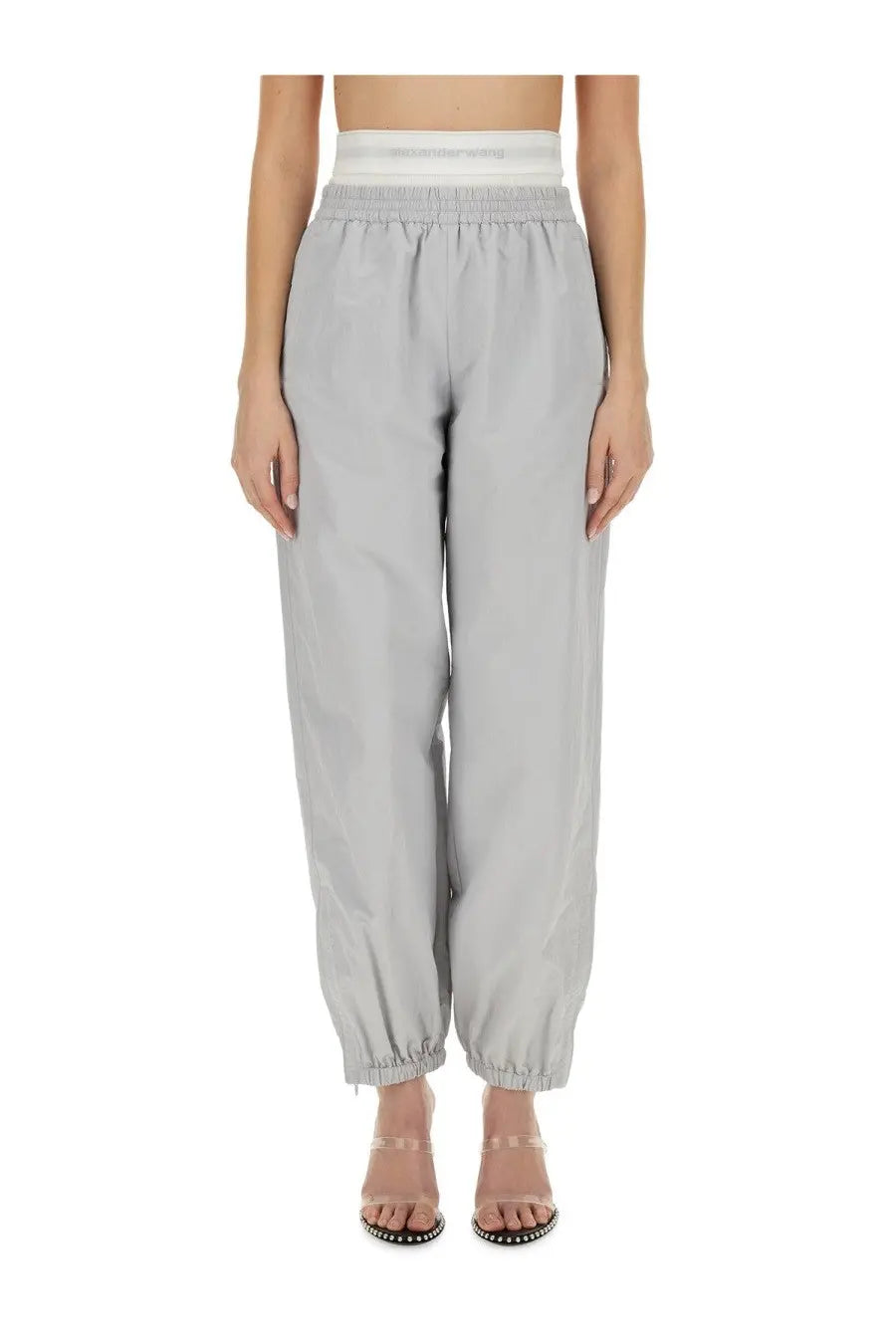 Light gray alexanderwang women’s high-waisted jogger pants with elastic waistband and cuffed hems for sportswear