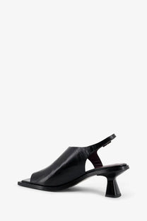 Alohas women’s Mahina leather sandal in black featuring a square toe and chunky block heel slingback design