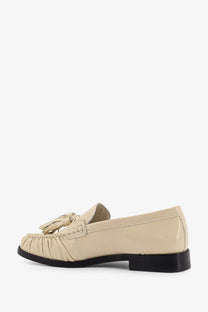 Alohas women’s Marietta leather loafers in cream-colored patent leather with tassel and ruched detailing