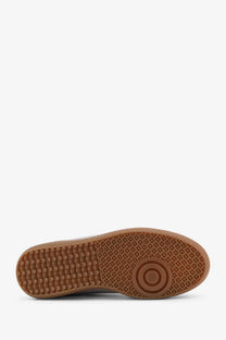Brown rubber sole with textured circular tread on alohas women’s rife metallized leather silver sneakers
