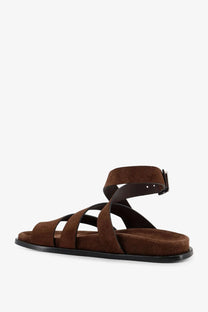 Alohas women’s brown suede strappy sandal with black rubber sole and adjustable ankle strap visible from the back side