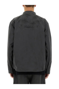 Alpha industries men’s laser cut shirt grey showing the back with dark gray textured fabric and mesh paneling