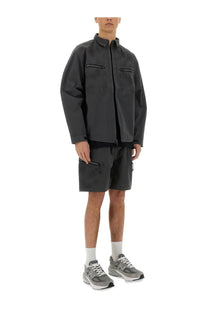 Alpha industries men’s laser cut shirt grey featuring a dark gray utility jacket with black zipper accents and chest pockets