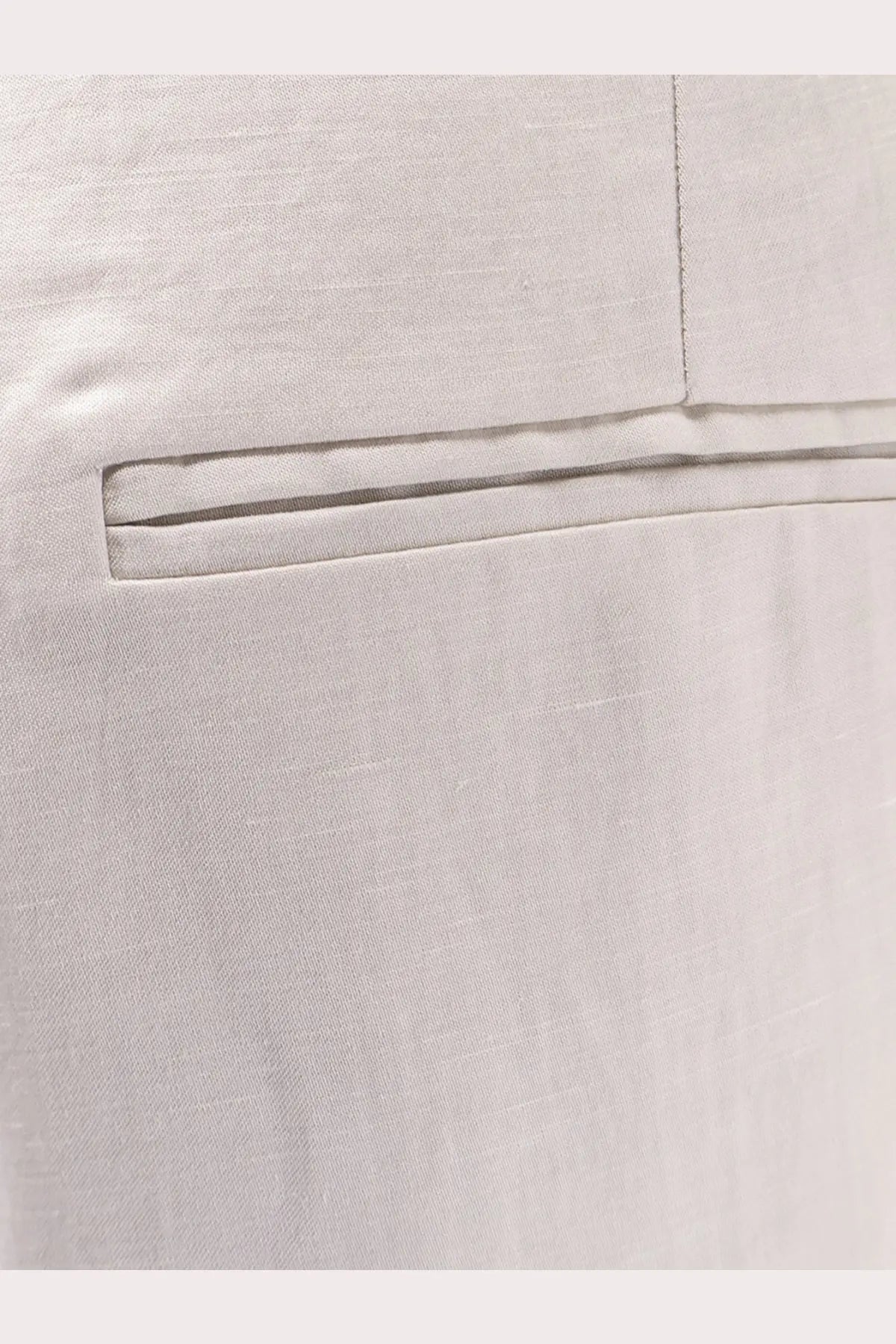 Light gray alysi women’s lyocell and linen trousers with a neatly stitched back pocket and clean precise seams