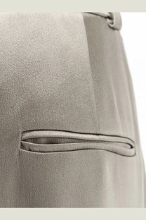 Alysis women’s beige satin trousers with a gray satin-finish pocket on a tailored back side