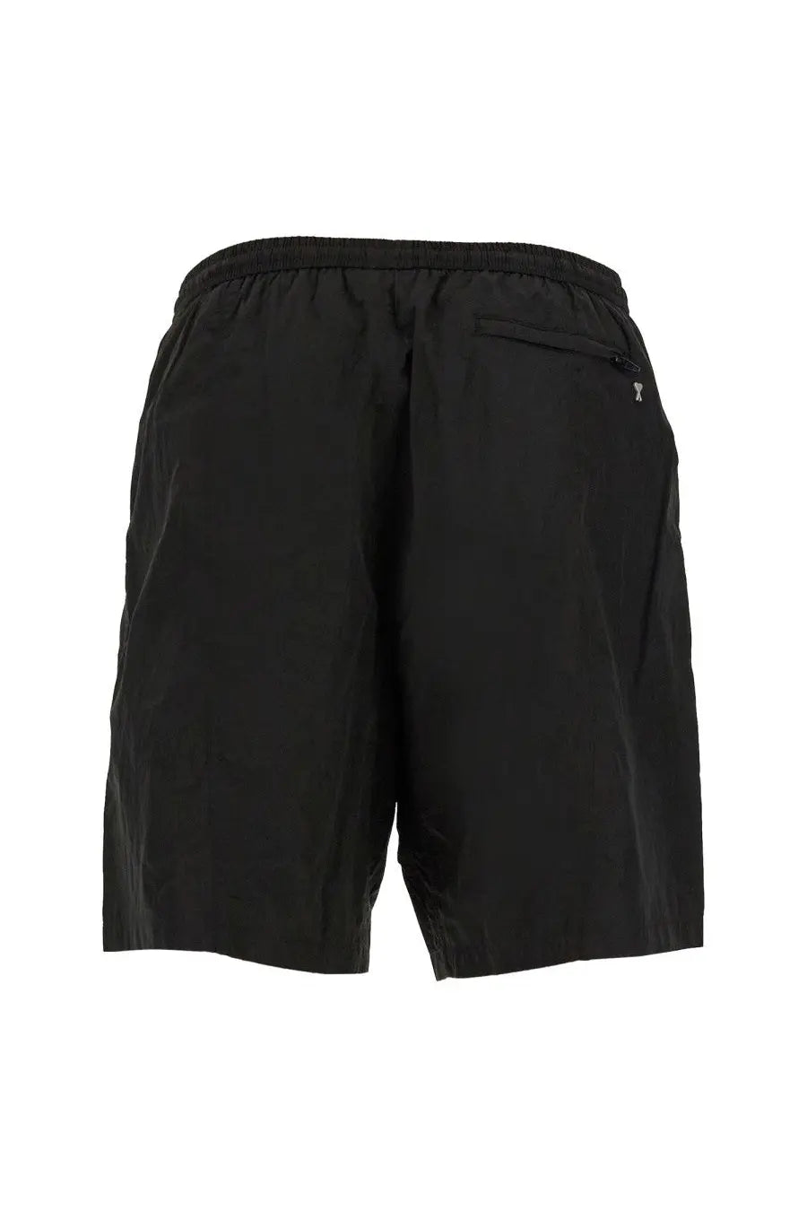 Back of ami paris men’s boxer swimsuit black showing elastic waistband and small zippered pocket on black athletic shorts