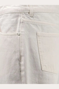 Ami paris men’s white cotton trousers in light-wash denim with subtle faded texture and classic stitching