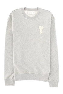 Ami Paris men’s heather gray crewneck sweatshirt with a white embroidered heart logo on the left chest