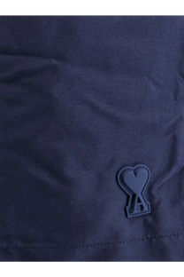 Dark navy ami paris men’s nylon swimsuit with matte black heart-shaped logo patch embossed with a inside