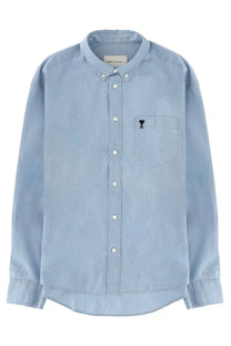 Ami Paris men’s light blue denim button-down shirt with subtle texture white buttons and black chest logo