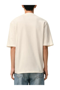 Cream-colored ami paris men’s oversized short-sleeved shirt with relaxed fit and simple crew neckline