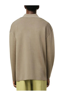 Beige long-sleeved wool blend polo shirt with structured collar and ribbed texture by Ami Paris for men