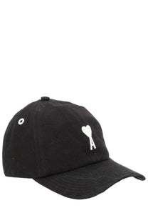 Black cotton baseball cap by ami paris with white heart logo and a stitched below it unisex design