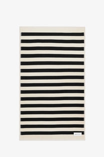 Ami Paris unisex cotton beach towel with bold black and cream horizontal stripes rectangular design