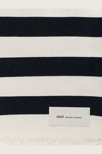 Ami paris unisex cotton beach towel black with black and white stripes and fringed edge featuring ami alexandre mattiussi label