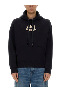Black ami paris unisex hoodie with beige embroidered lettering and silver-toned drawstring tips in blue design