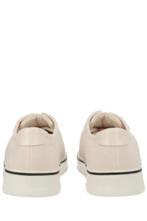 Beige canvas ami paris unisex tennis sneaker with black trim and white rubber soles for casual wear