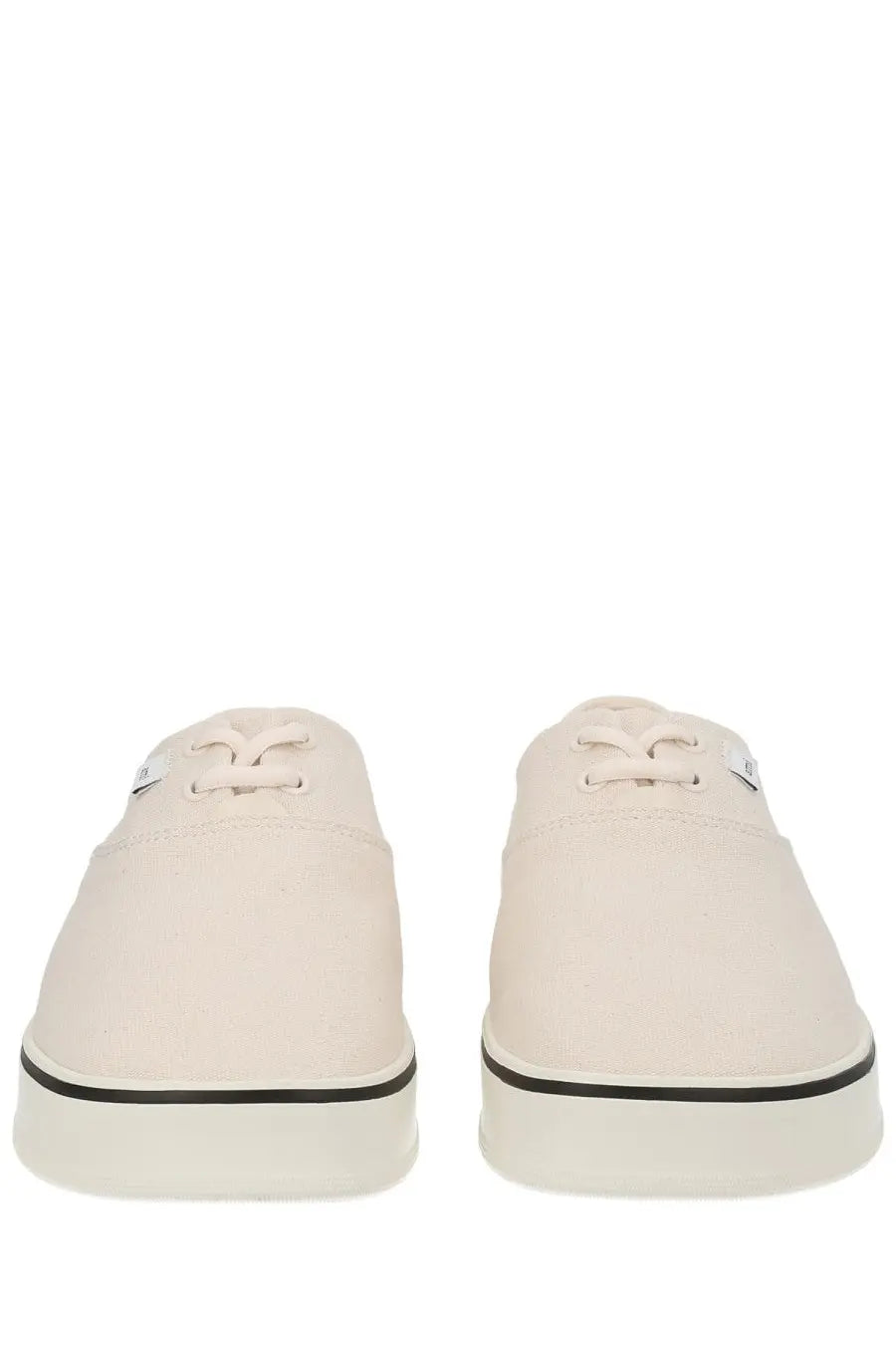 Cream-colored canvas ami paris unisex tennis sneakers with black rubber soles and laces for casual wear