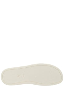 Off-white rubber sole with subtle embossed logo on ami paris unisex tennis sneaker white back side