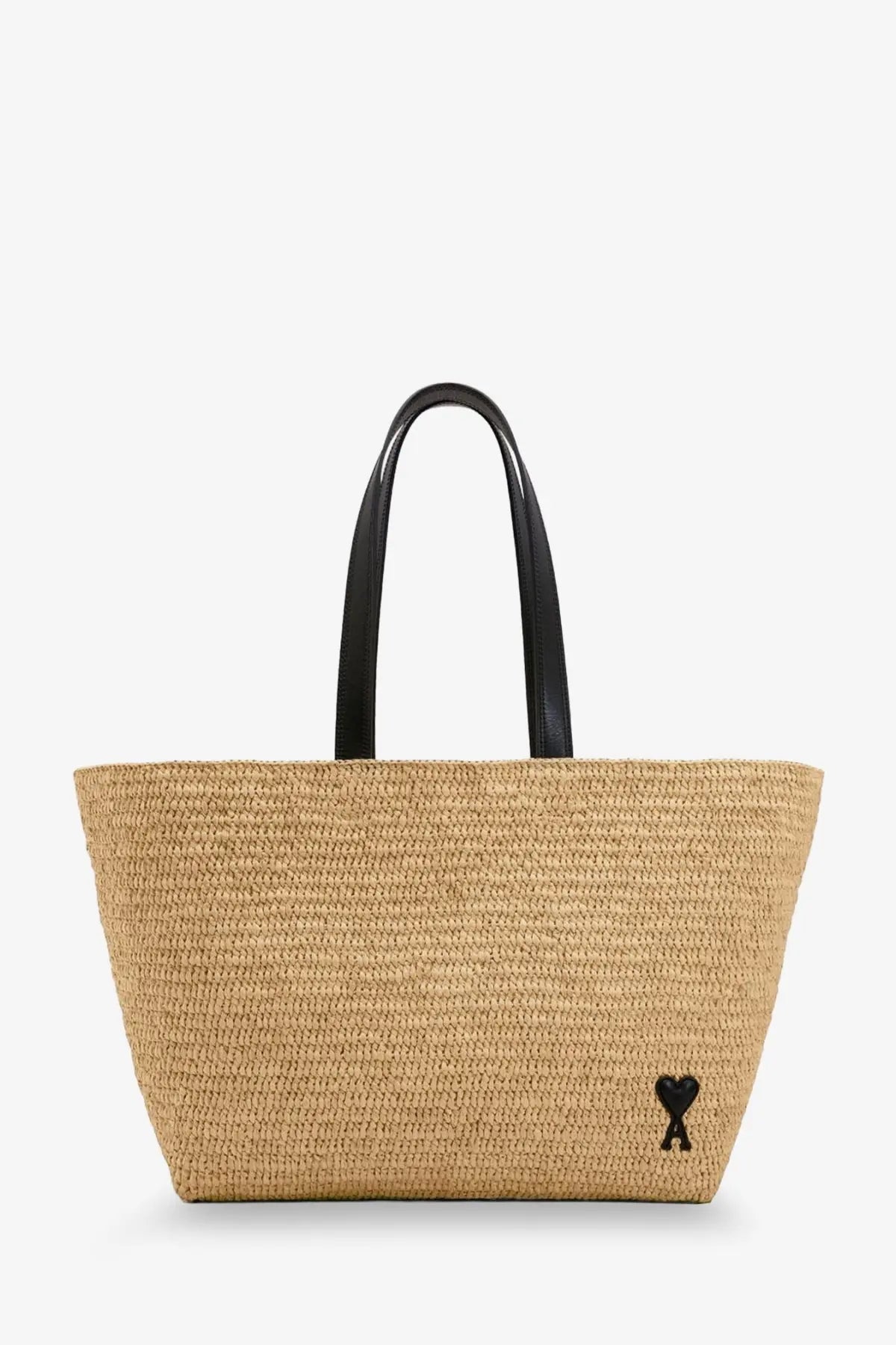 Beige woven straw tote bag with black leather handles and a small black heart logo by ami paris