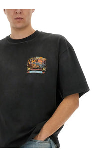 Black oversized AMIRI men’s jazz hideaway shirt with colorful vintage-style jazz and America graphic print