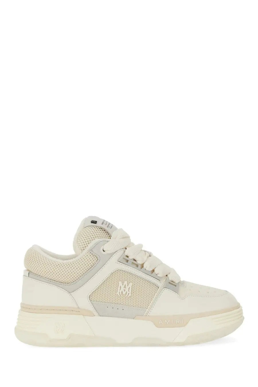 Cream-colored AMIRI men’s low-top sneaker with mesh and synthetic overlays featuring subtle side logo