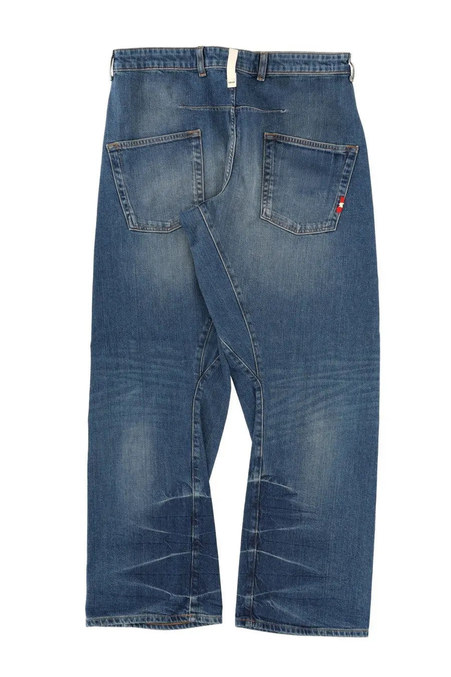 Back side of amish supplies men’s jeans twist slub blue denim with faded wash subtle distressing and red logo on pocket