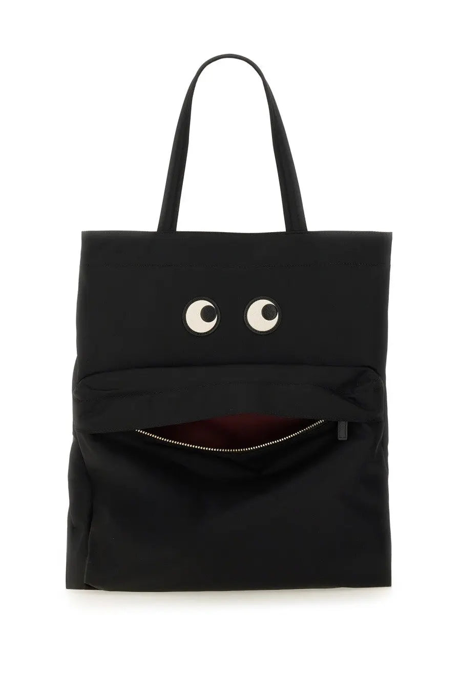 Anya Hindmarch women’s black tote bag with playful googly eyes and a zipper-mouth design