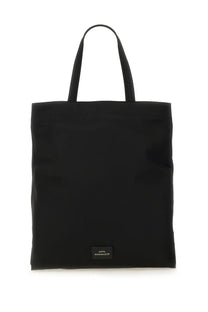 Anya Hindmarch women’s borsa tote black canvas bag with two handles and small rectangular label at the bottom