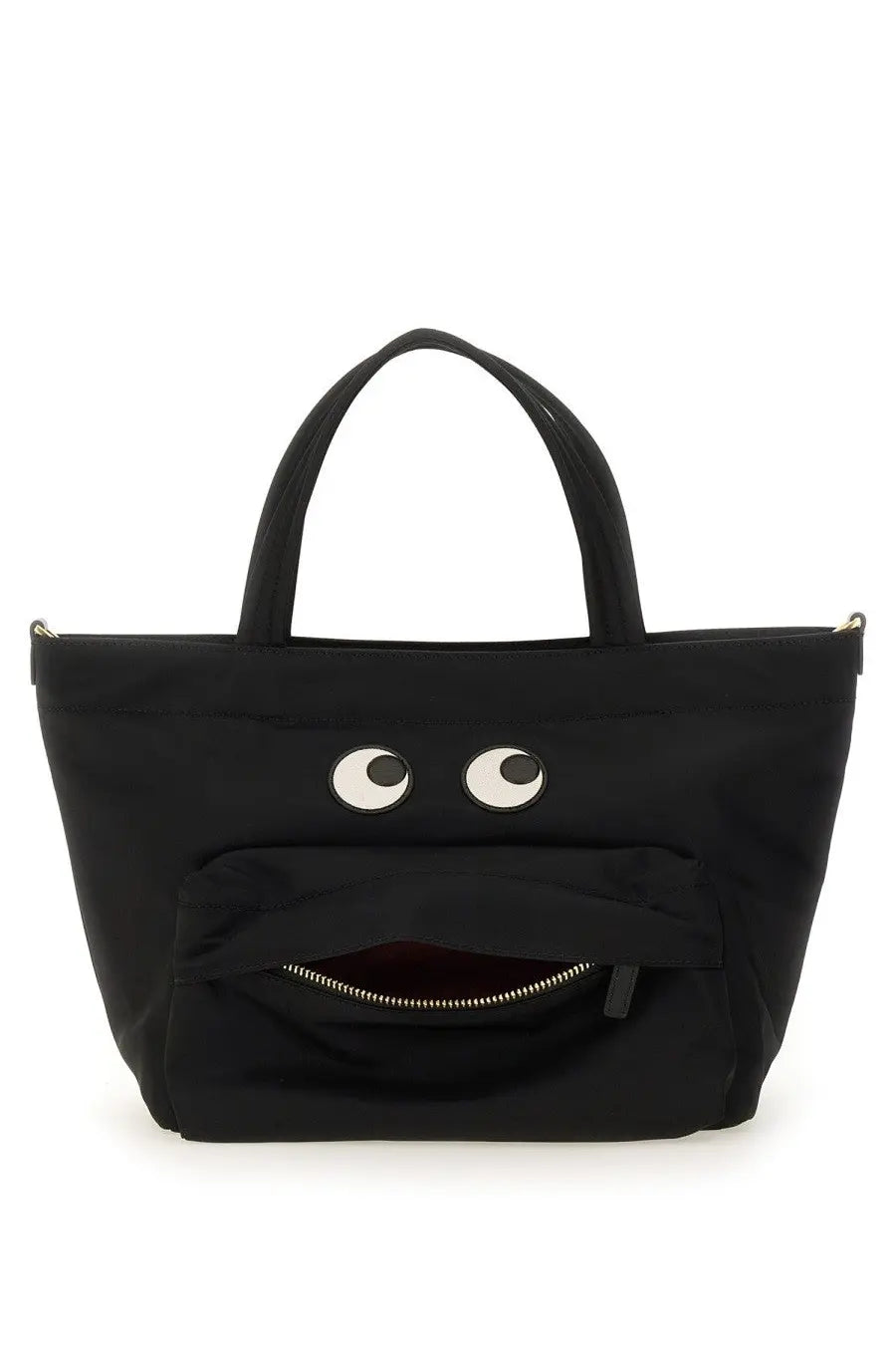 Anya Hindmarch women’s black canvas tote bag with playful white eyes and zipper-mouth design in mini size