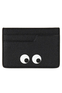 Anya Hindmarch women’s black textured card holder with playful white googly eyes and black pupils
