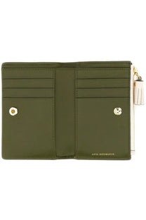 Anya Hindmarch women’s olive green leather wallet with gold hardware and white tassel zipper pull