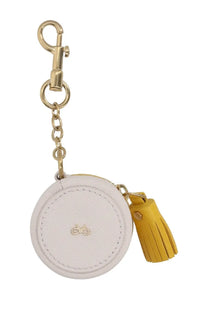 Anya Hindmarch white leather circular coin purse with gold hardware and mustard yellow tassel portamonete Carmex yellow