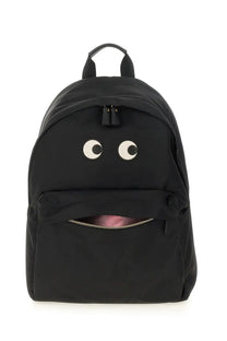 Anya Hindmarch women’s zaino black backpack featuring white circular eyes and a zipper-mouth design on front