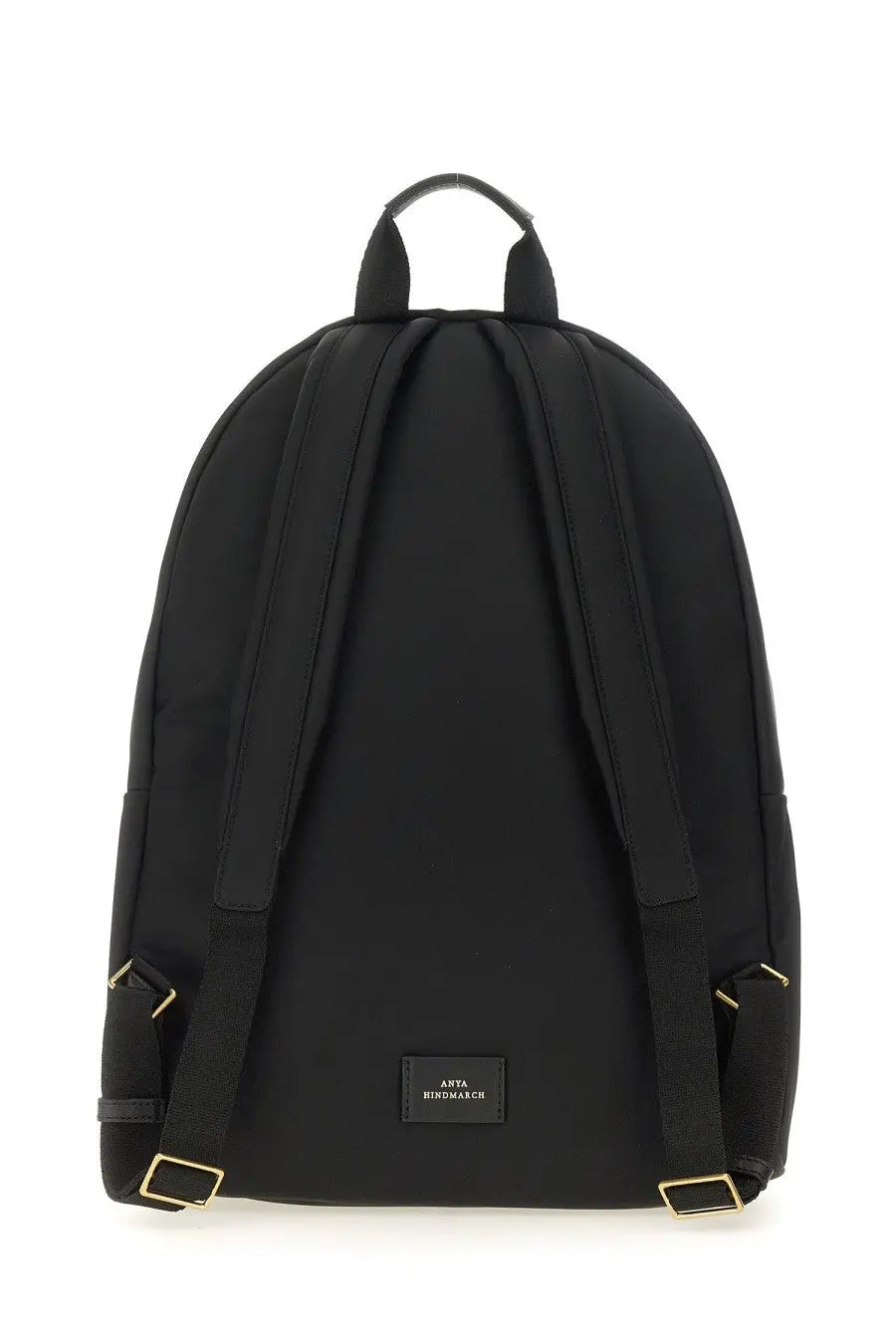 Anya Hindmarch women’s black nylon backpack with gold-tone hardware and small rectangular brand label at the base