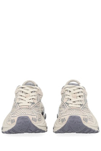 Beige mesh ash women’s dragon sneaker with gray rubber soles seen from the back showing ash branding on the heel