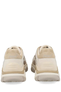 Beige and cream ash women’s sneaker addict sneaker with textured mesh upper and layered rubber sole shown from the back