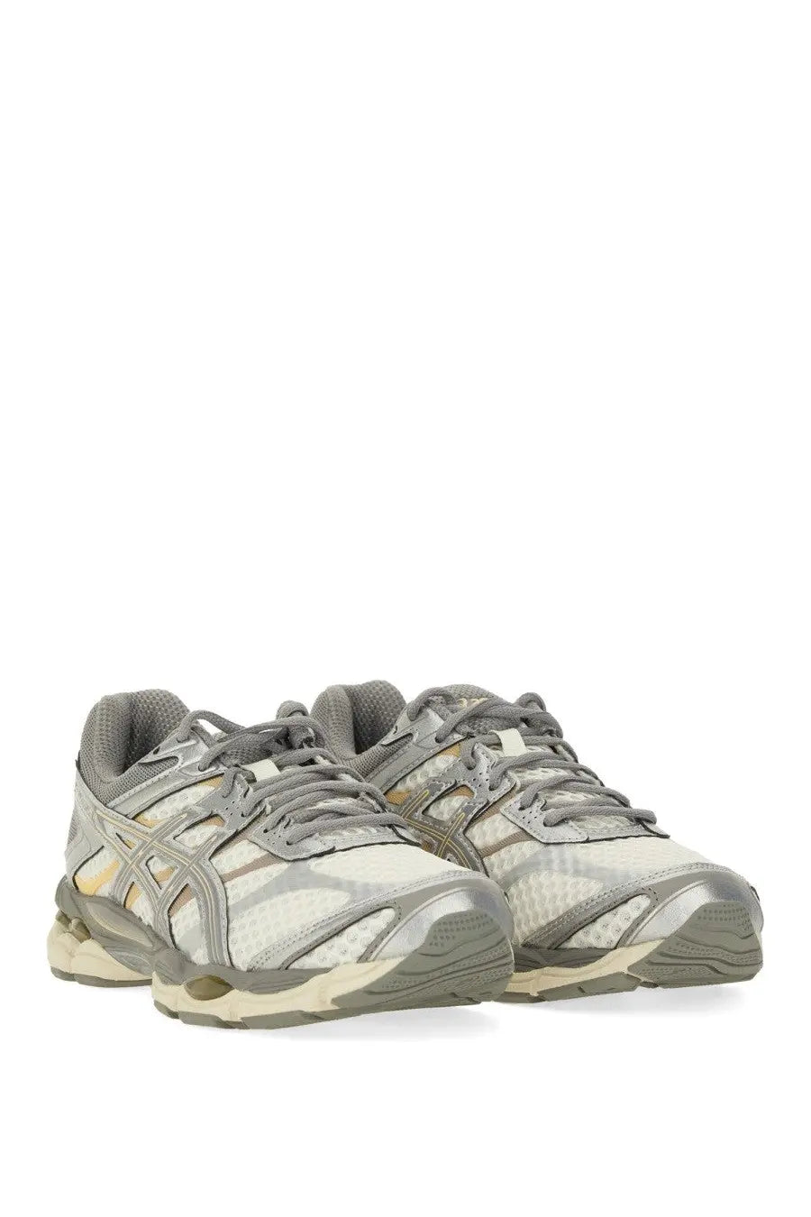 Gray and beige asics unisex gel cumulus sneaker with mesh upper, metallic silver accents, and cushioned sole
