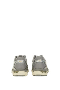 Gray asics unisex gel cumulus running shoes with mesh upper and metallic silver heel accents shown from the back side