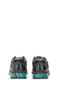 Asics unisex gel quantum sneaker in black and gray with translucent turquoise midsoles for running and casual wear