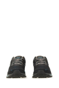 Black asics unisex gel quantum running shoes with gray laces and subtle teal accents on the sides