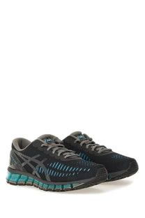 Asics unisex gel quantum sneaker in black and teal with breathable mesh upper and visible gel cushioning technology