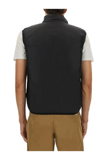 Black quilted sleeveless vest with high collar for men by aspesi in black for versatile layering and warmth